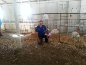 Jane Roberts showed turkeys for the first time at the 2013 Wright County Fair. She brought home the trophy for Champion, Reserve and even showmanship.