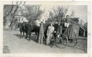 It took an entire family to bring in a load of corn back in 1939. Janice’s grandpa, Fred, is leaning against wheel. Her father is pictured next to him. Just imagine the manual labor involved!