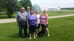 Ray and Jean Beutz are raising their three children on the same farm where his father was born and raised. Pictured in the back row, from left to right, Matthew, Brian and Miranda with their dog, Molly.