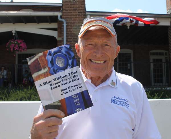 Don Greiman with his book "A Blue RIbbon Life". Photo credit: Agri-news.com