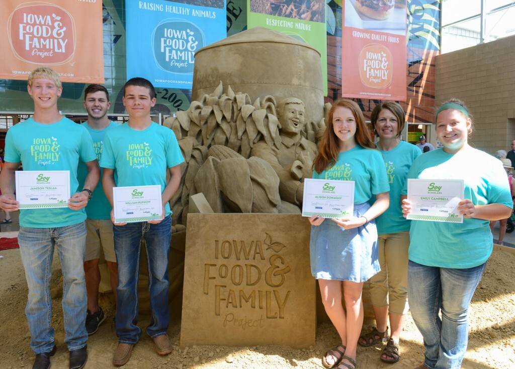 Soy Scholars yesterday were presented with a certificate for completing a three-part agricultural career experience. The third session was held yesterday at the Iowa State Fair where they volunteered at the Iowa Food and Family Project booth in the Varied Industries Building and also were treated to a fair tour by Iowa State Fair Ambassador Don Greiman. Pictured in the front row, from left to right, are the 2016 Soy Scholars: Jamison TeSlaa of Boyden-Hull High School, Hull; William Rupnow of East Sac High School, Nemaha; Alison Donaghy of Dowling Catholic High School, Des Moines; and Emily Campbell of Audubon High School, Hamlin. Pictured in the back row are sponsors Easton Kuboushek of the Iowa Soybean Association and Shannon Latham of Latham Hi-Tech Seeds. 