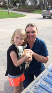 It’s not uncommon for Dr. Katie Lang’s daughter, Emma, to go along on vet calls. Emma loves animals as much as her mother. 