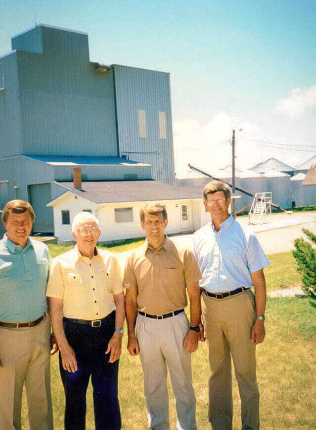 Tom, Willard, Don and Bill Latham in front of processing plant copy